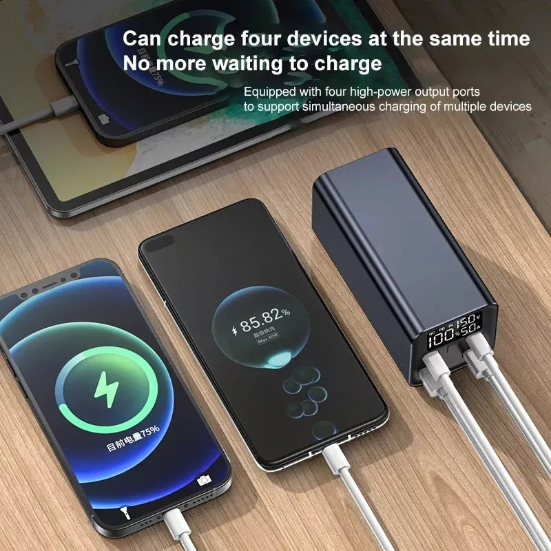 Black metal 65W laptop power bank with 20000mAh capacity showing size next to a laptop.