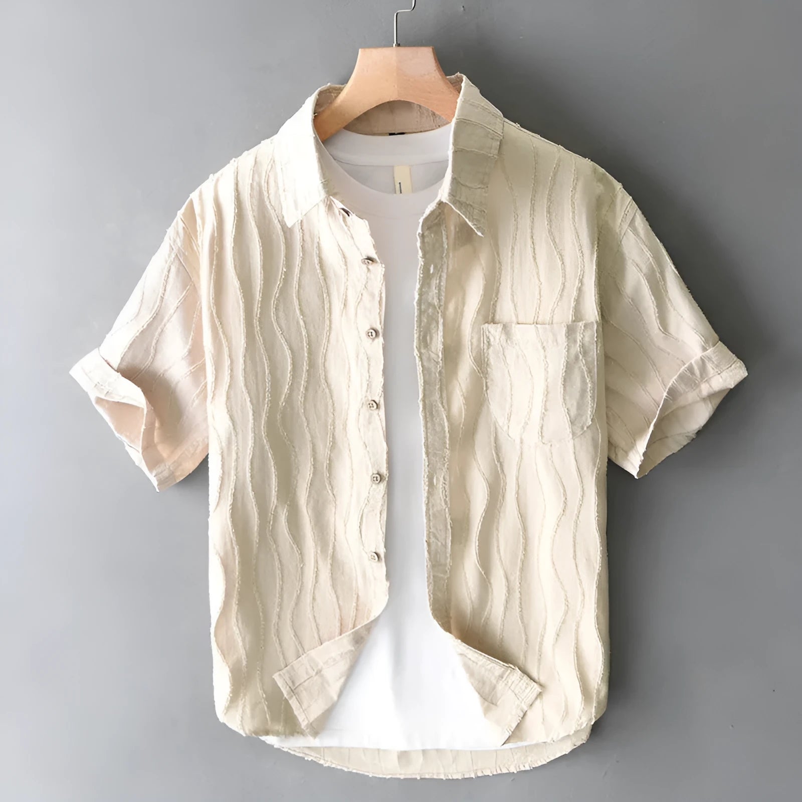 Men's apricot pure cotton loose-fit short sleeve casual shirt on a hanger.
