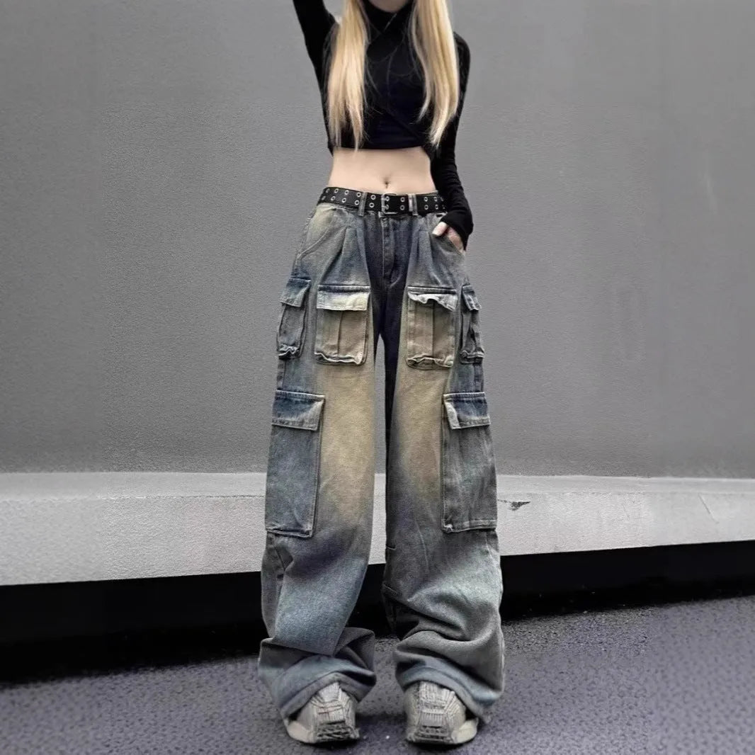 Man wearing loose light blue distressed jeans with multiple pockets, showcasing the straight-leg and utility style.