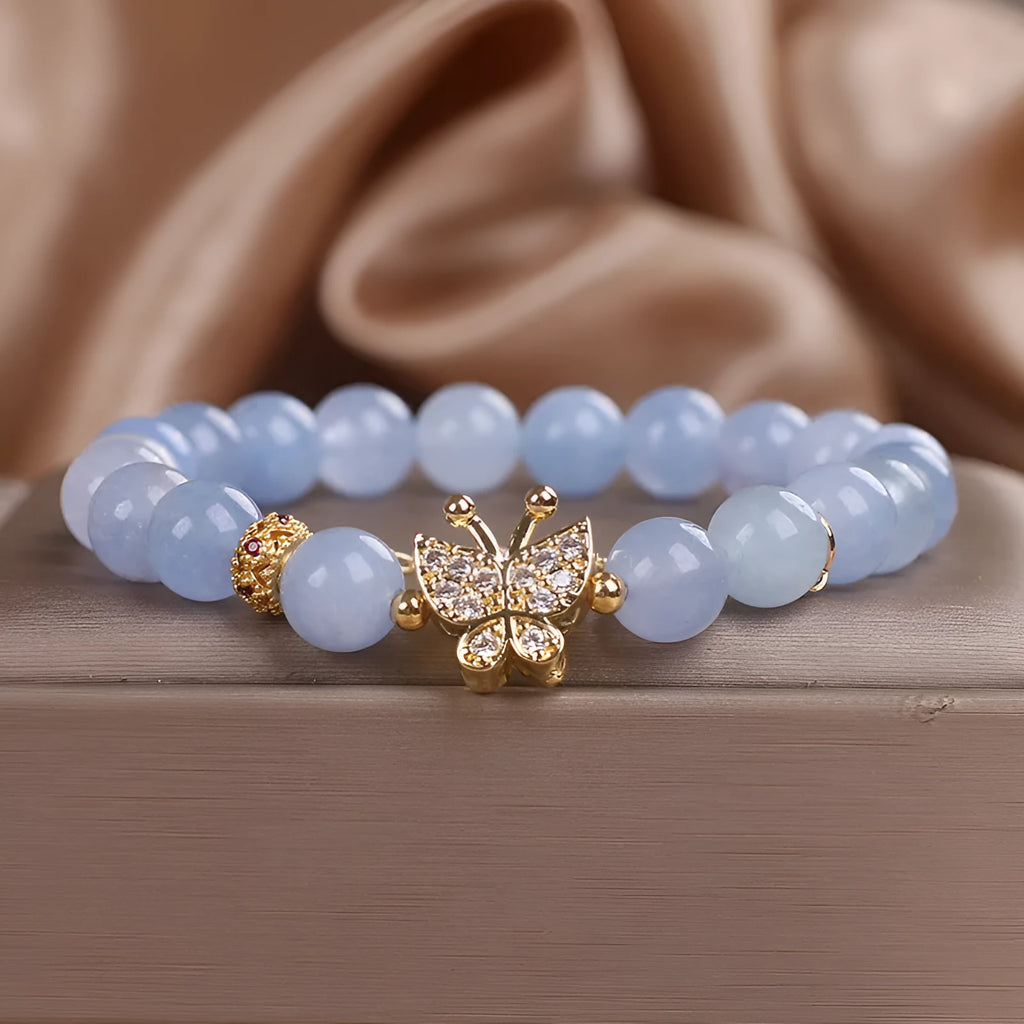 Sky blue butterfly crystal bracelet for women with pearls, rhinestones, and sequins on a 17cm chain.