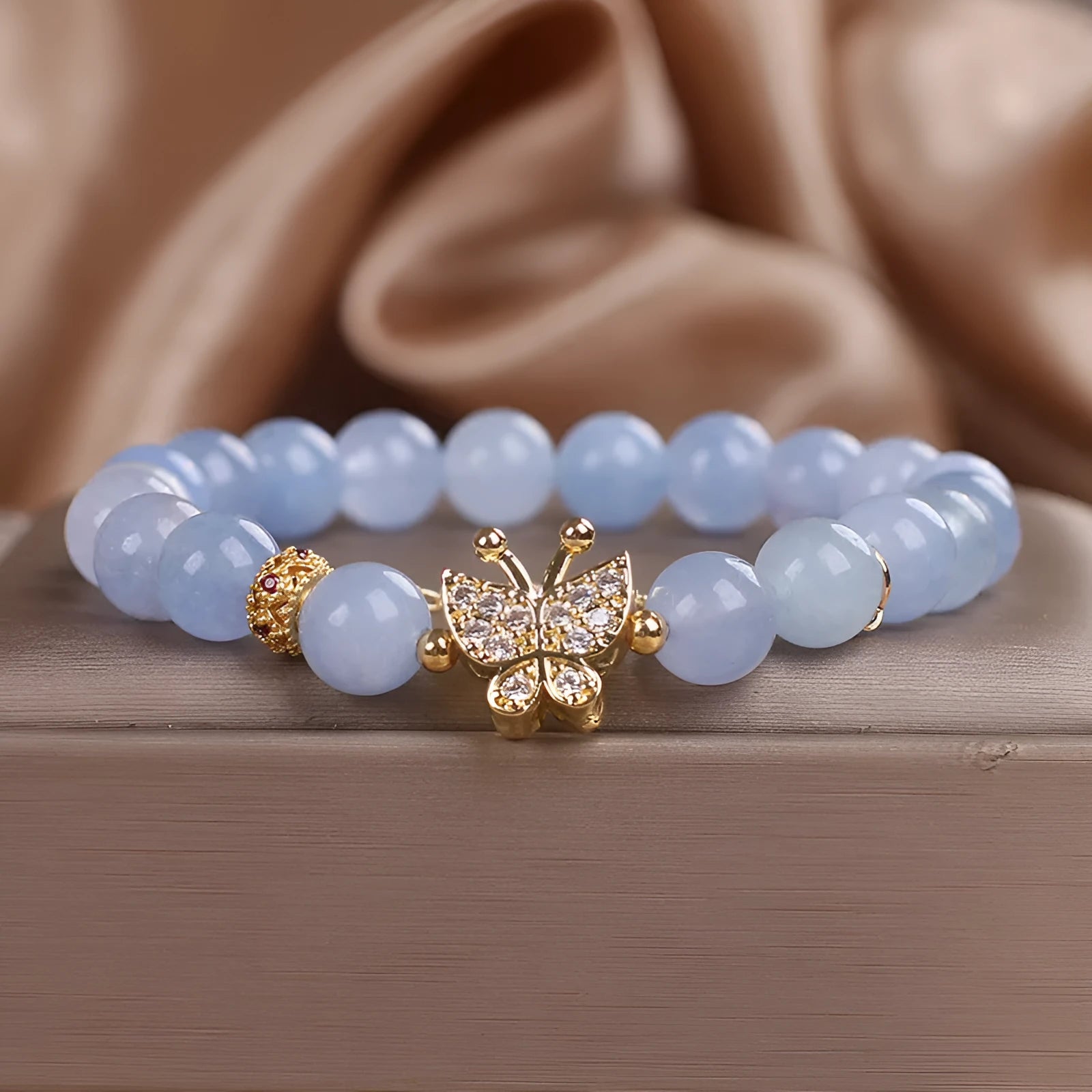 Sky blue butterfly crystal bracelet for women with pearls, rhinestones, and sequins on a 17cm chain.