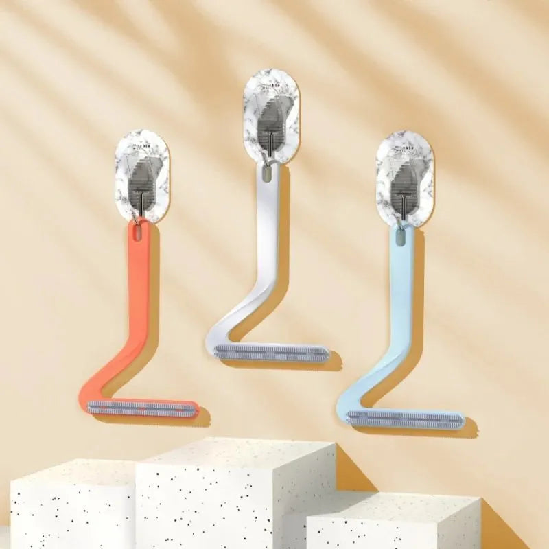 Double-sided pet hair removal comb in blue, white, and orange with sticky suction for cat and dog hair