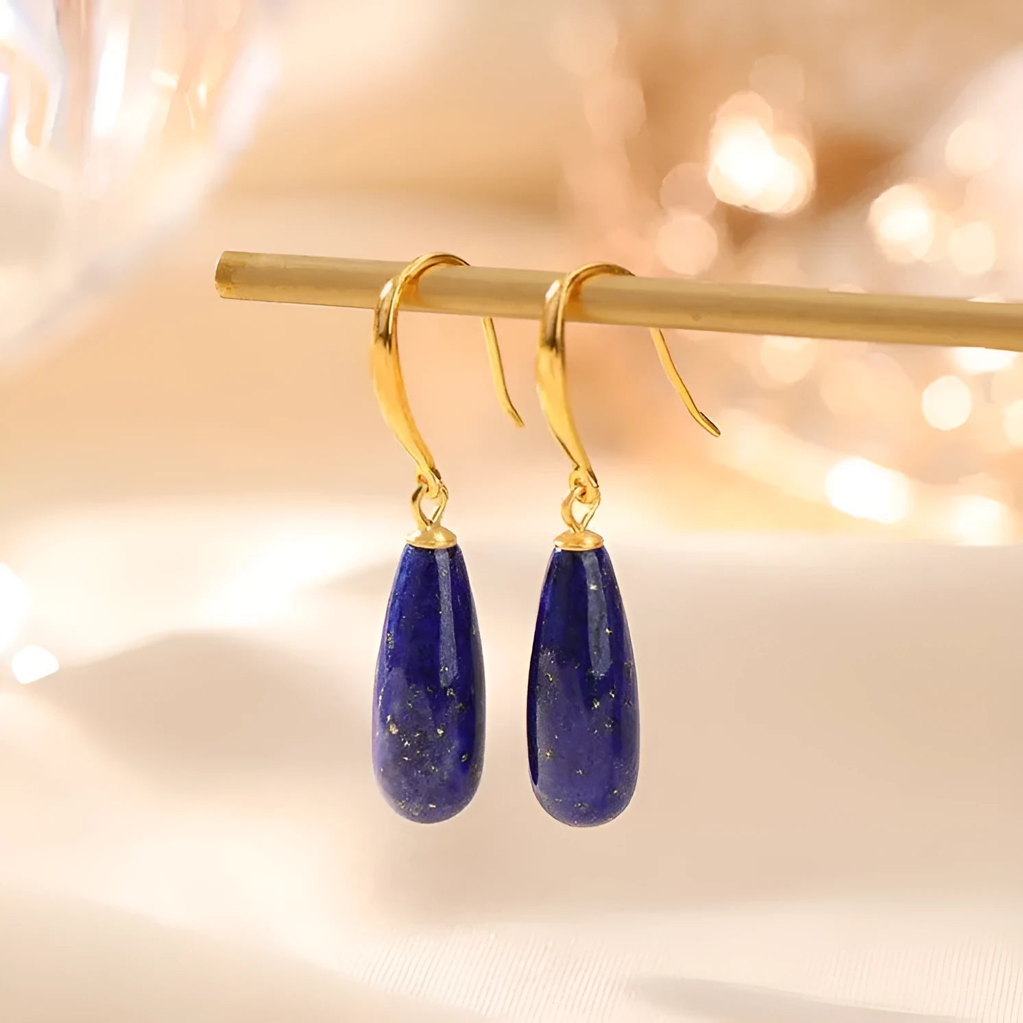 Gold-plated silver drop earrings with natural lapis lazuli stone in geometric water droplet shape