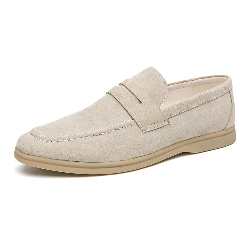Men's black leather slip-on casual shoes with a round toe and rubber sole on a white background.