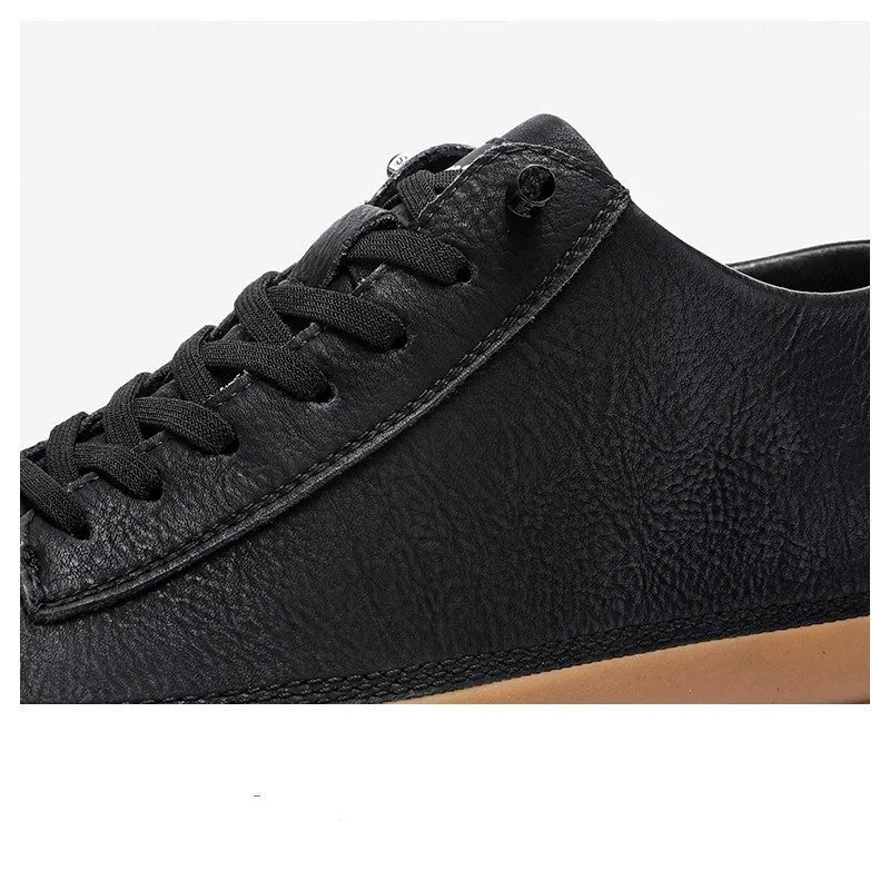 Men's black casual leather shoes with round toe and lace-up front on a white background.
