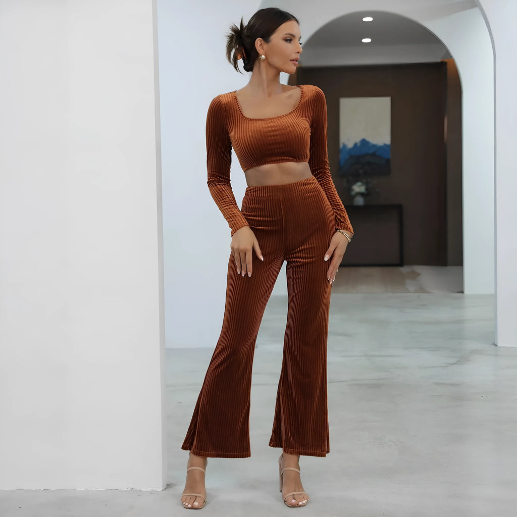 Caramel coloured long sleeve sweater and straight-leg trousers set on a hanger