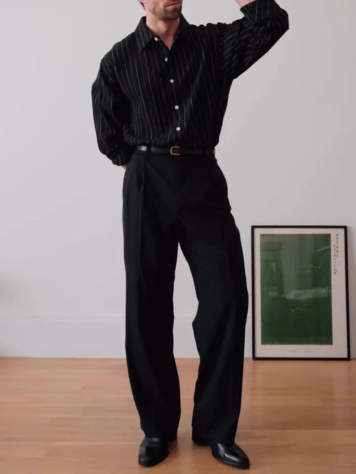Black pinstriped button-down polyester shirt on a hanger, showing regular fit and striped pattern.