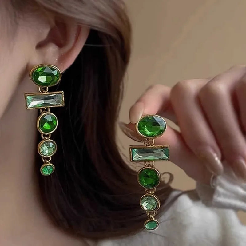 Green gradient tassel dangle earrings with geometric metal frame and sparkling zircon stones.