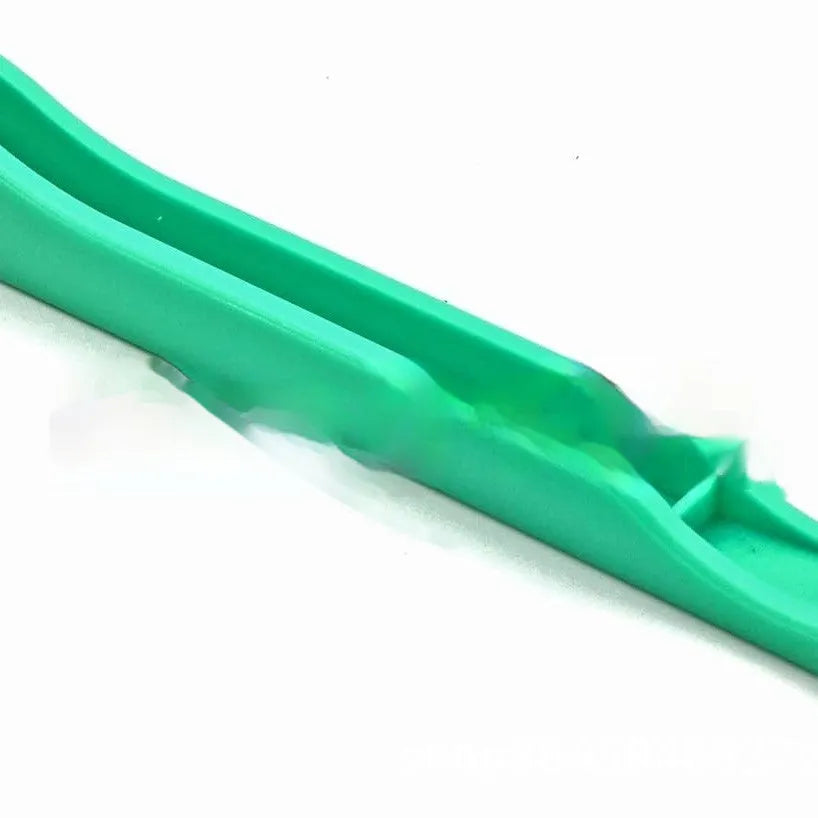 Plastic hand foil tool in green on white background, 14cm length for nail art