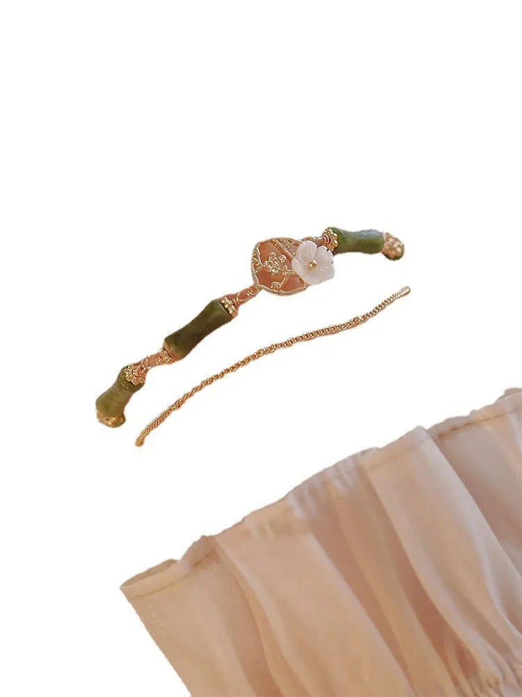 Handmade olivine bracelet with double layer Twin Bells of Ireland design on adjustable string cord