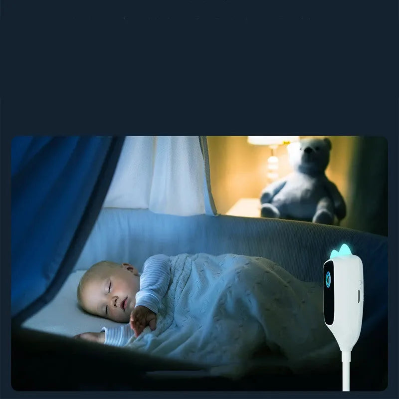 White smart baby monitor with 1080p HD night vision and 150 degree wide angle lens on a shelf