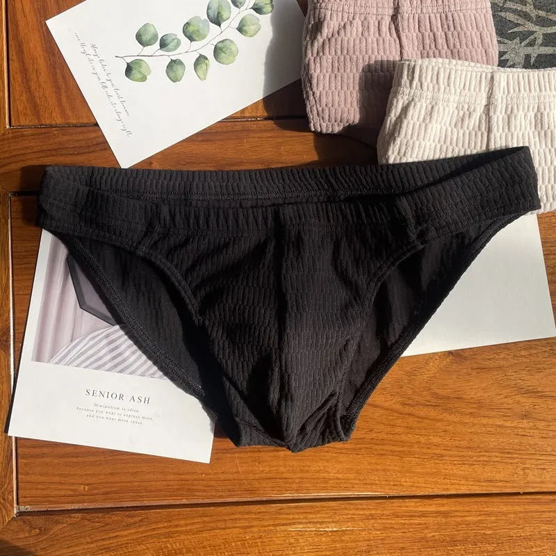 Men's pure cotton triangle briefs in a solid colour on a mid waist.