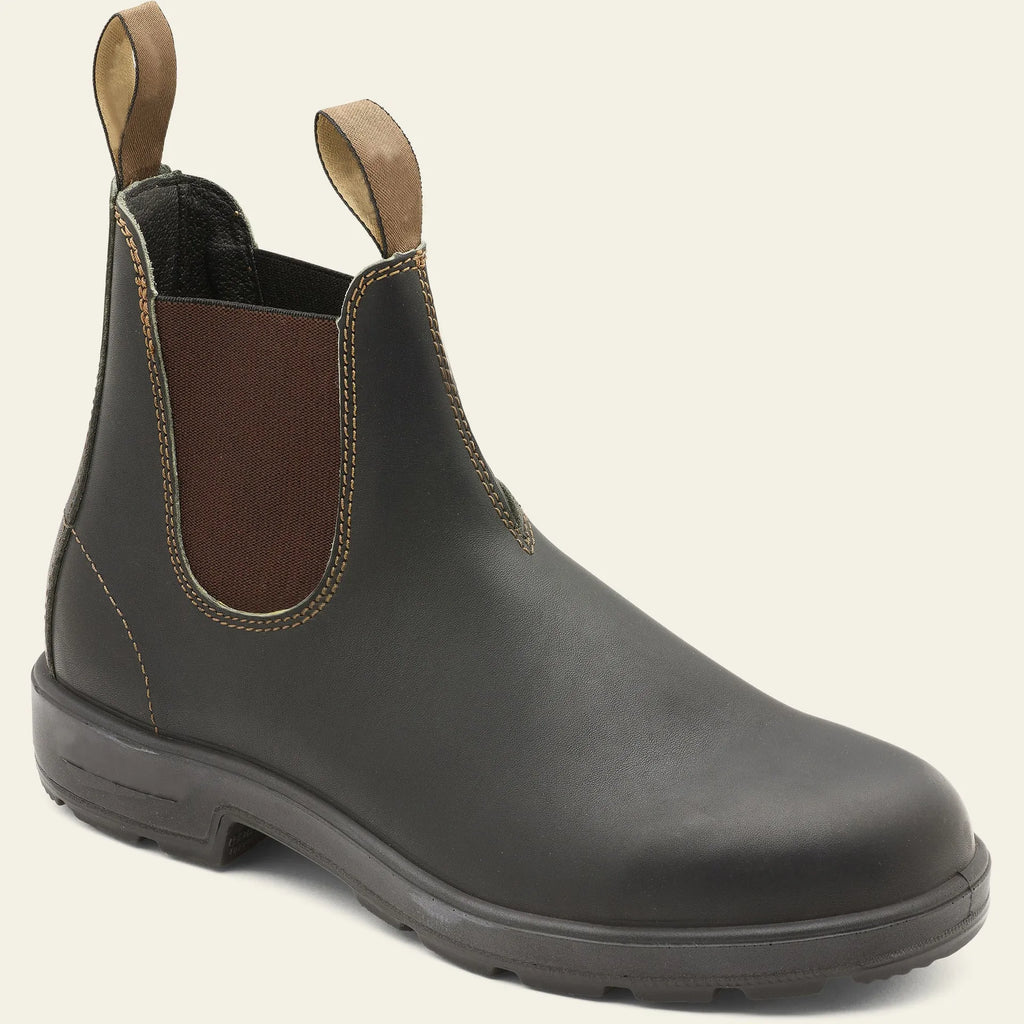 Vintage brown unisex Chelsea boot with frosted PU upper and car suture detailing on a wooden floor.