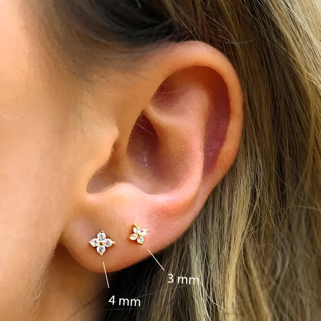 S925 sterling silver stud earrings with geometric petal and flower crystals in gold or platinum finish.
