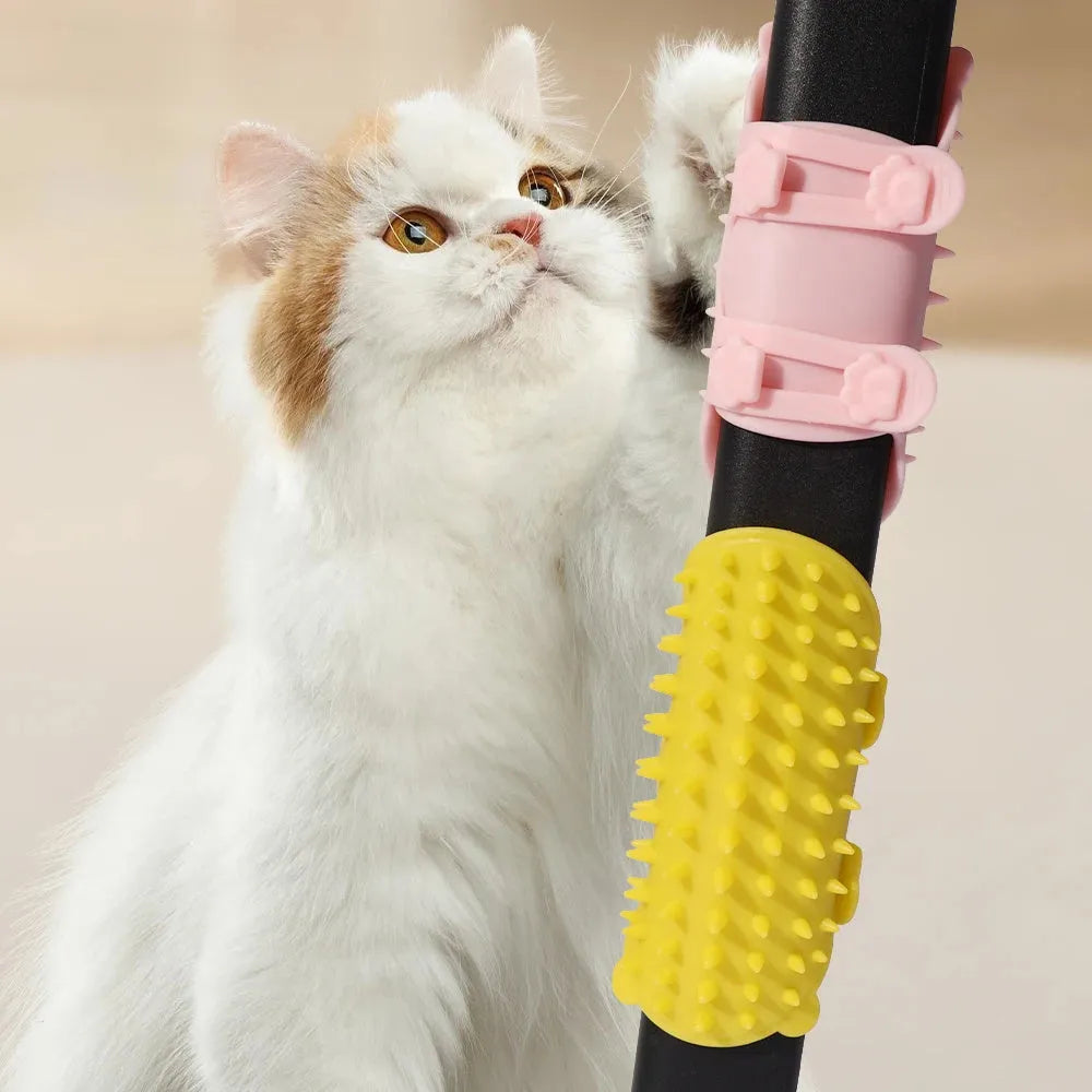 Silicone cat grooming comb with adjustable strap mounted on a furniture leg