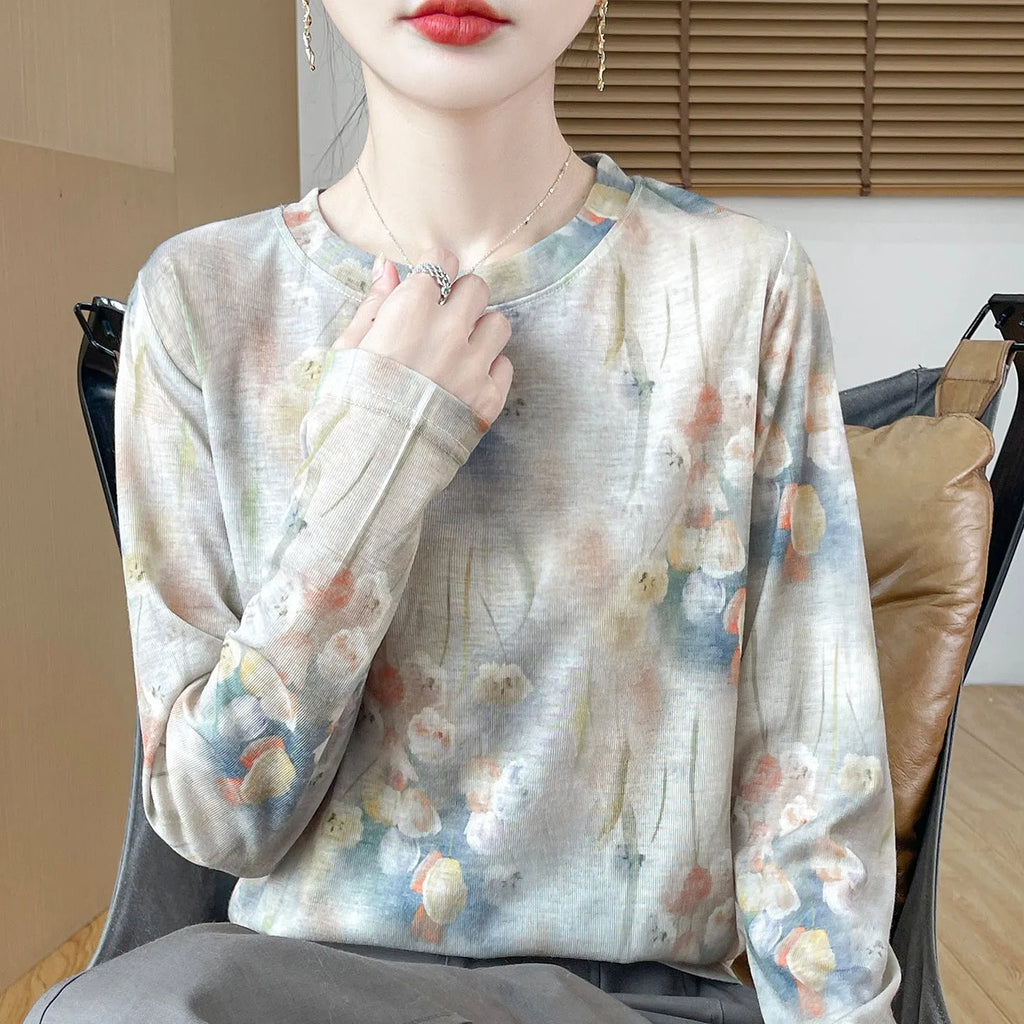 A women's round neck pullover in a Tencel cotton knitted fabric, shown in a printed colourway with regular sleeves.