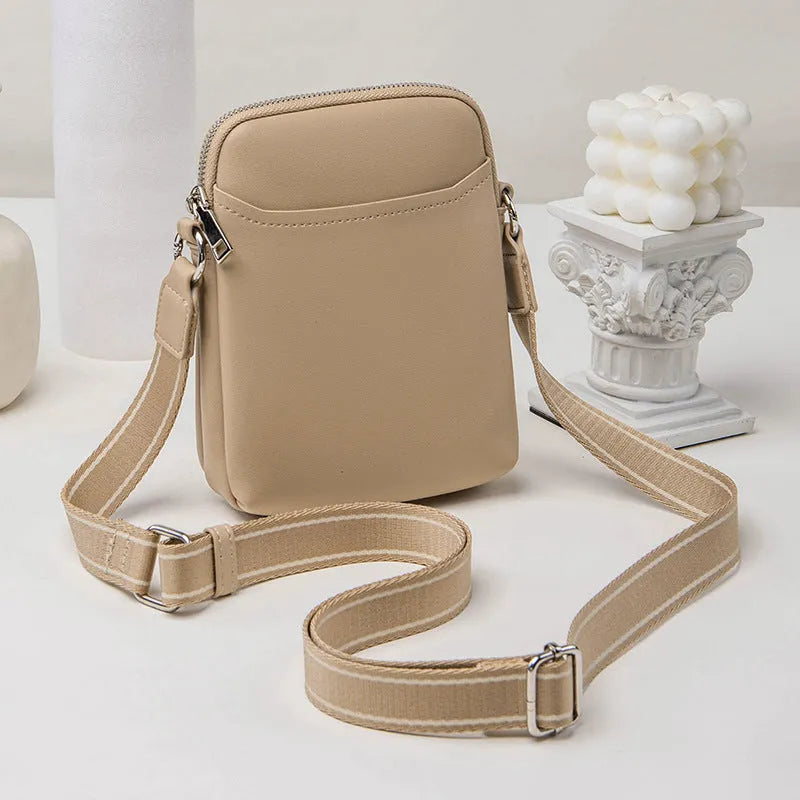 Solid colour PU leather crossbody phone bag in beige, shown with adjustable strap.