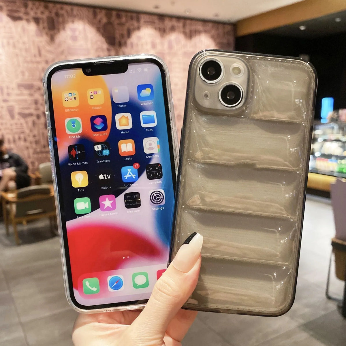 Transparent TPU air cushion phone case for iPhone 15 series with down jacket design, shown in transparent and transparent black.