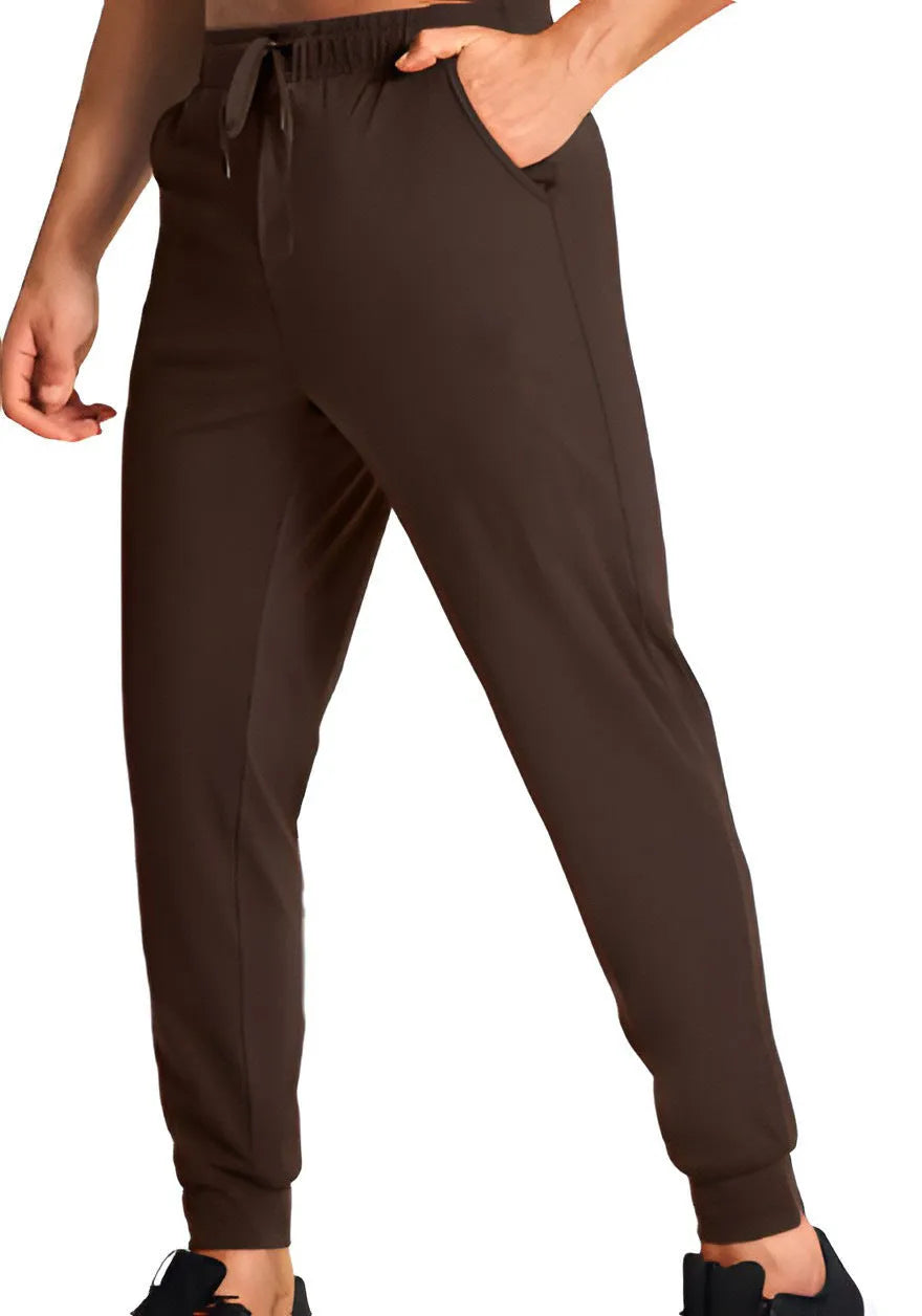 Men's loose fit casual trousers in solid colour polyester fabric showing relaxed cut and casual styling