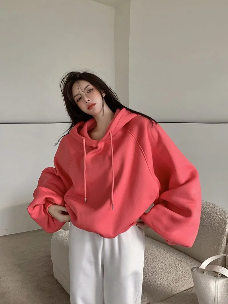 Watermelon red women's sleeveless hooded sweater made from mulberry silk fabric.