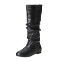 Women's black slip-on knee-high flat boots with a round toe and rubber sole.