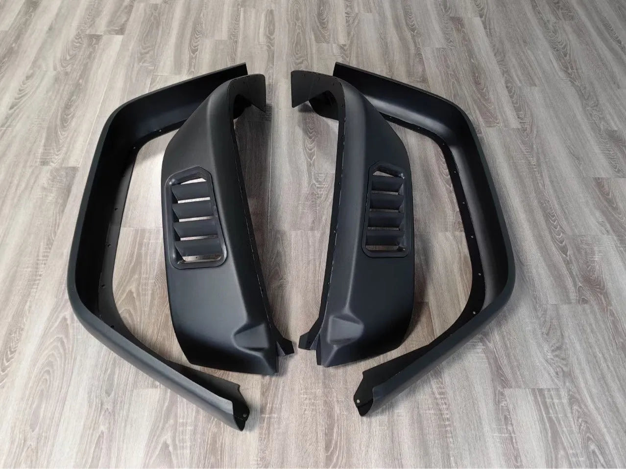Black plastic car wheel arch set of four for universal fit on automobiles