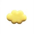 Resin cartoon car fragrance clip in pastel colours on a car air vent.