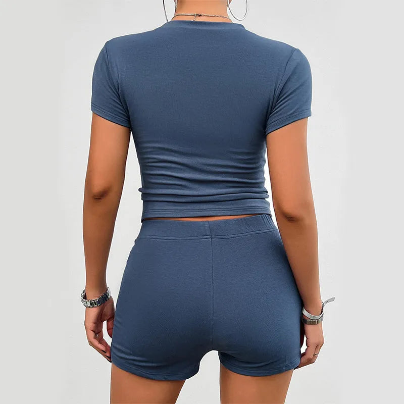Women's solid colour viscose fibre slim-fit T-shirt and elastic shorts two-piece set.