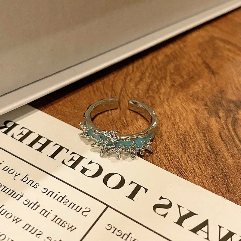 Creative butterfly design women's ring in copper with oil drip finish, showing an open loop style.