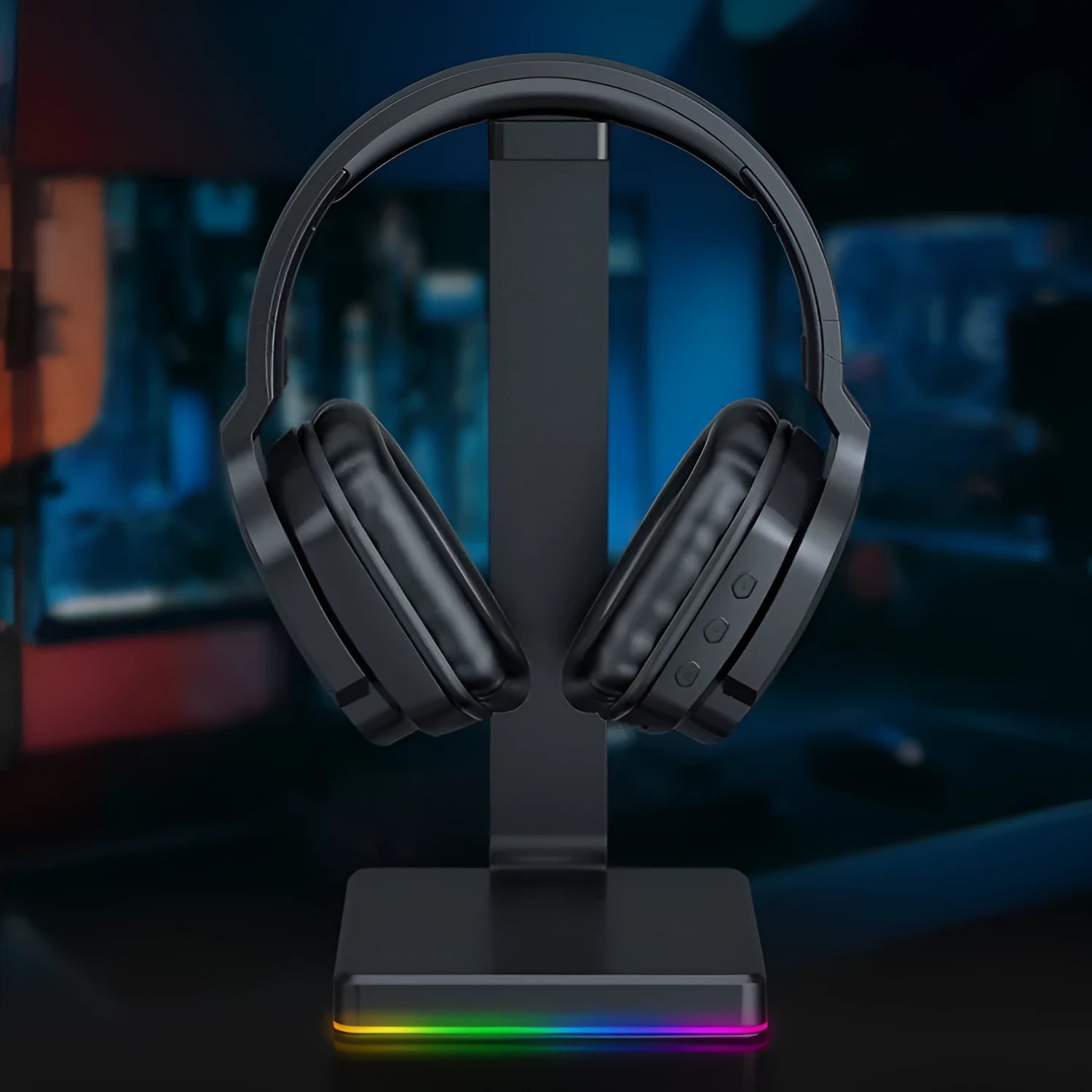 Luminous black wireless over-ear headphones with headband, shown with included 3.5mm cable and dust bag.