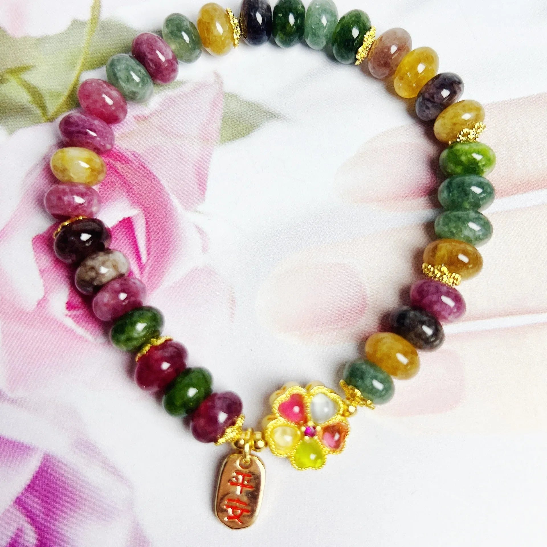 Colorful tourmaline abacus beads crystal stretch bracelet for women on a white background
