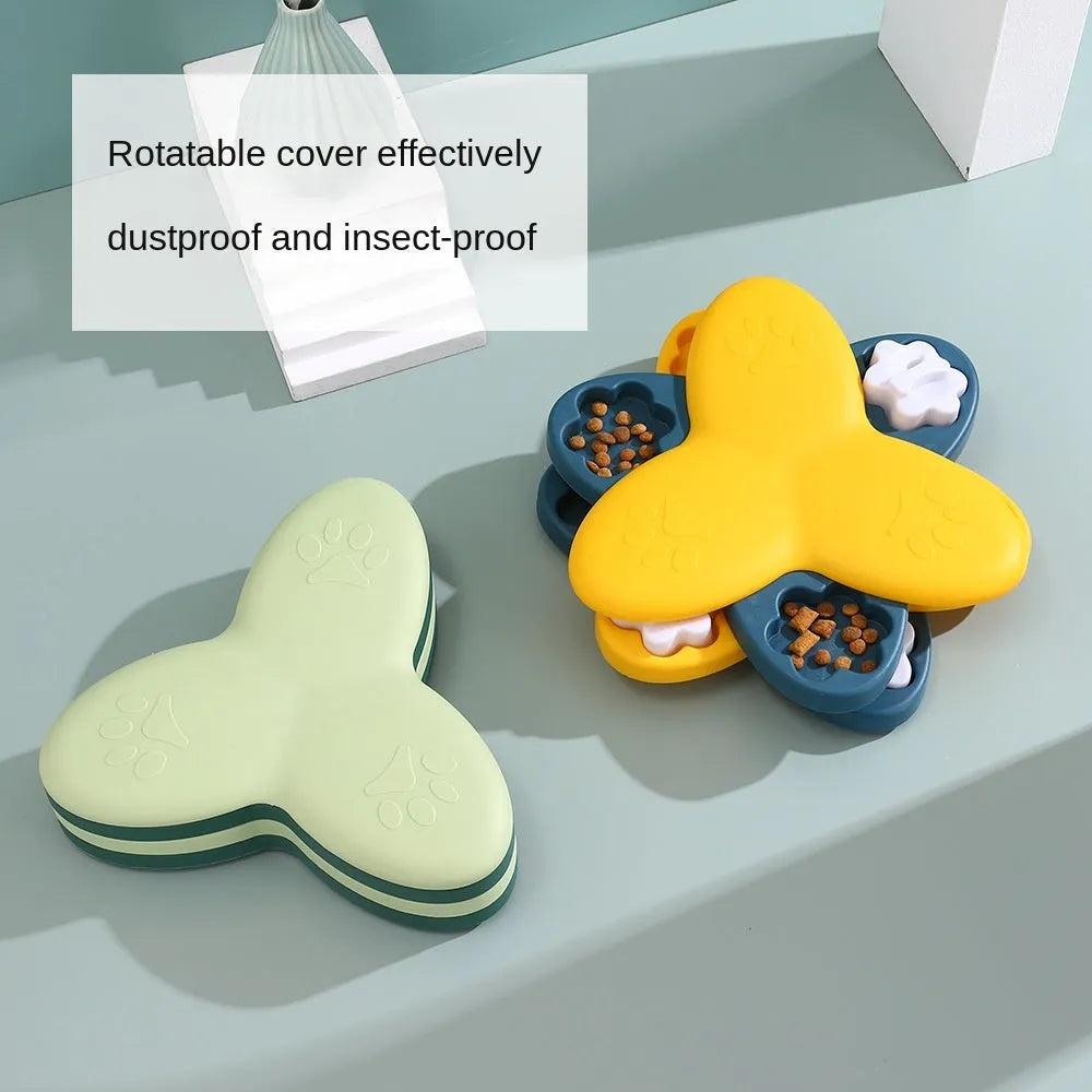 Green and yellow interactive dog puzzle toy slow feeder bowl with nine bone-covered compartments.