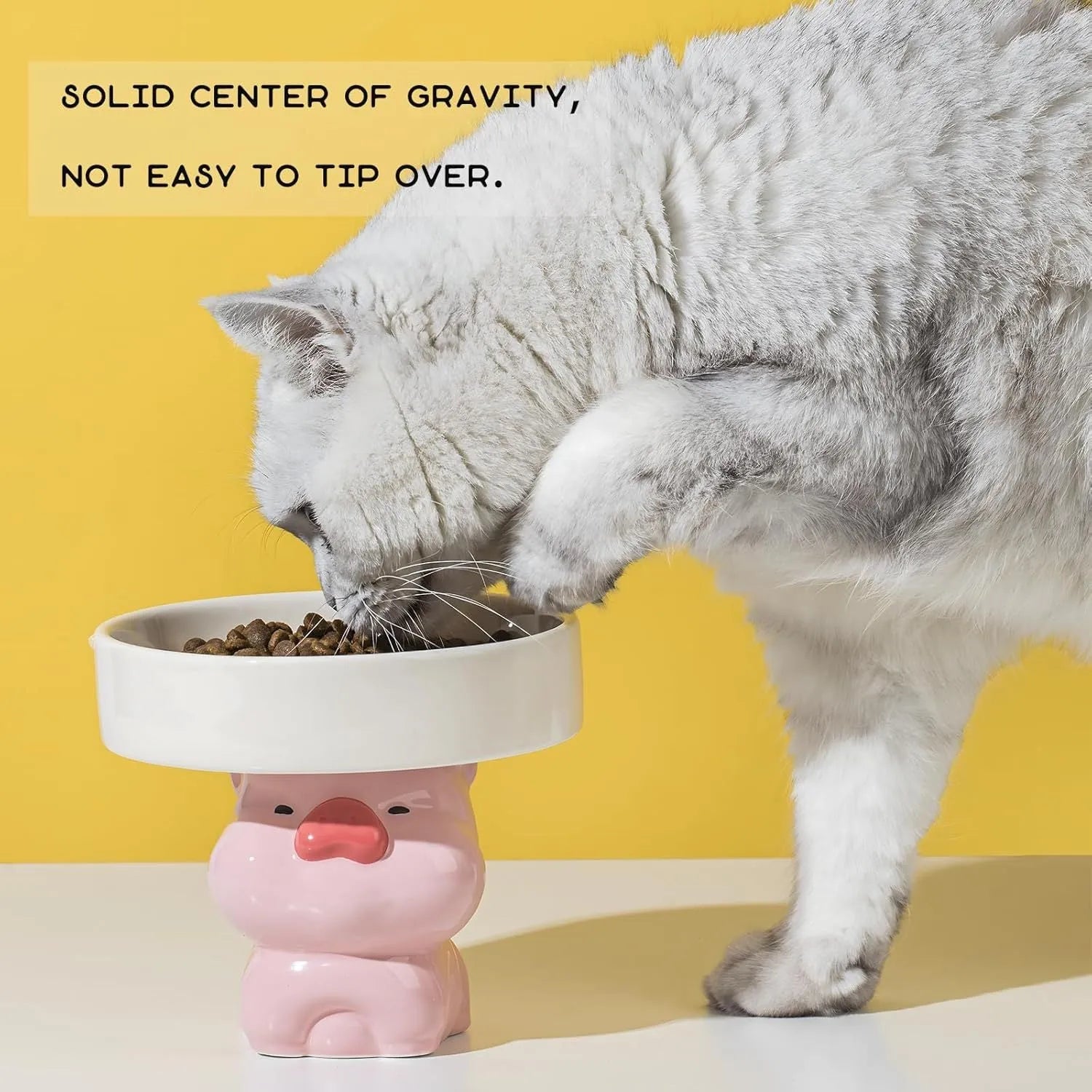 Raised ceramic pet bowl in animal design, showing wide shallow dish on elevated base.
