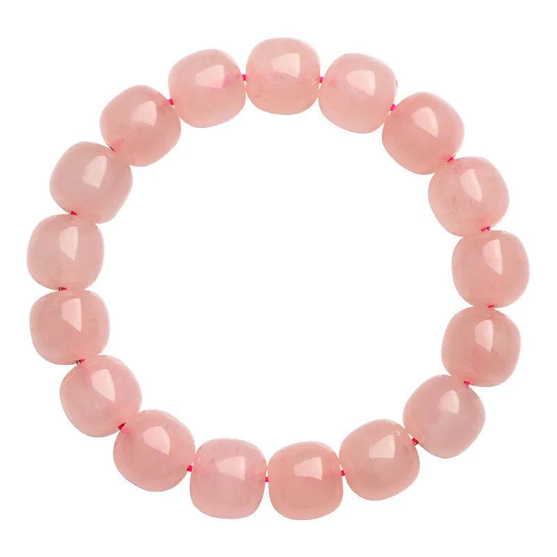 Close-up of a pink natural crystal bracelet with polished barrel-shaped beads measuring 8-10mm.