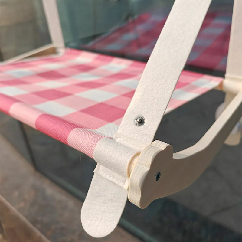 Wooden cat window hammock bed with linen fabric attached to window by suction cups