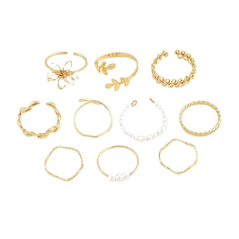 Gold colour openwork flower ring with detailed floral design and glossy electroplated finish