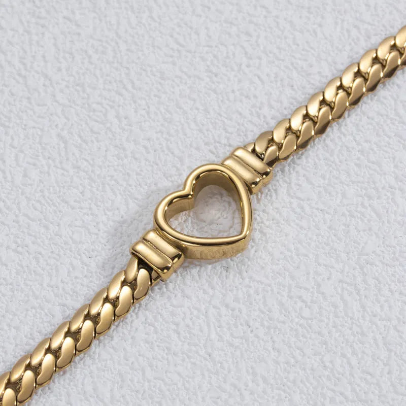 Fashion simple hollow heart titanium steel bracelet in BR-26 gold colour with electroplated finish