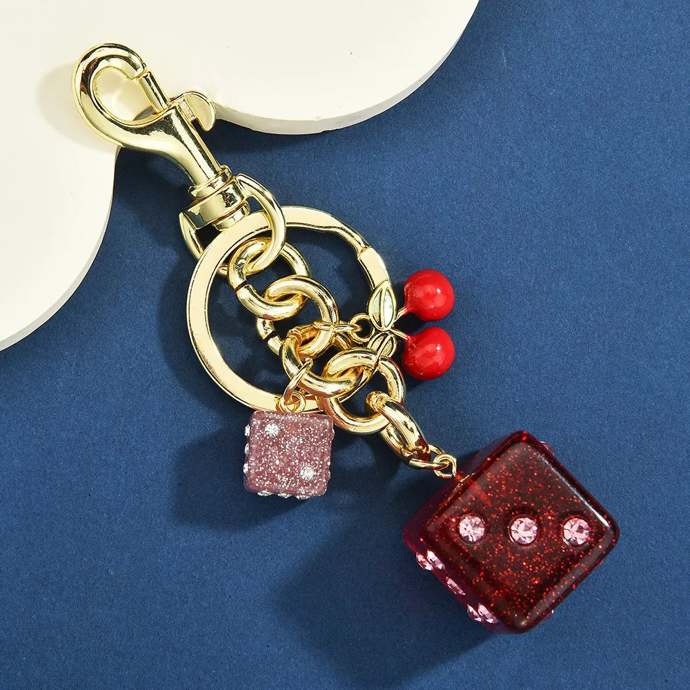 Vintage cherry red two-tone metal dice bag keychain pendant with a square geometric shape