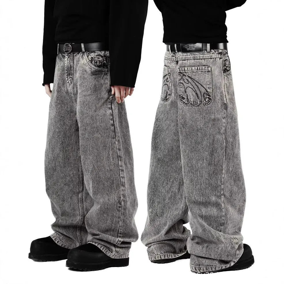 Grey loose-fit straight-leg denim trousers for men laid flat, showing mid-waist and straight-leg cut.