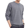 Man wearing a standard wool pullover sweater in light grey, regular fit, for autumn and winter.