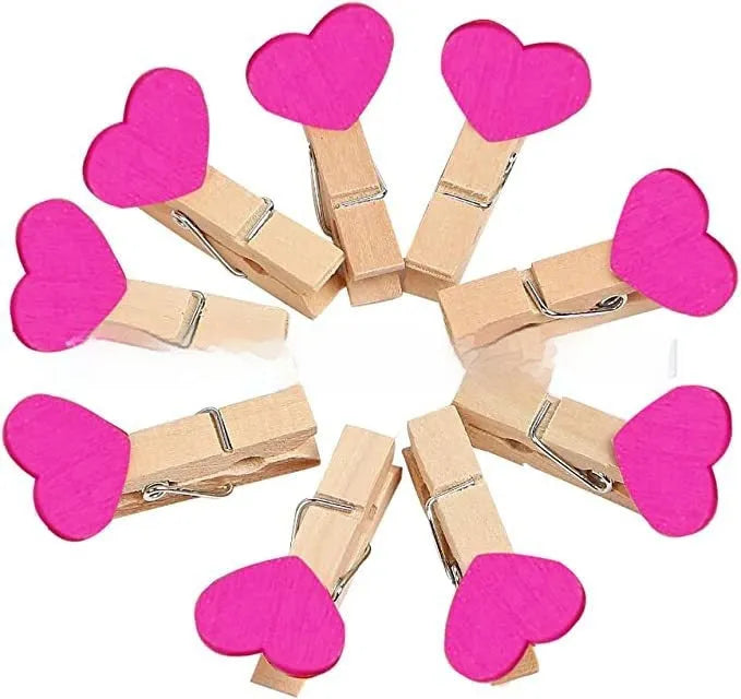 Set of five solid wood heart-shaped hair clips in red, white, and rose red on a plain background.
