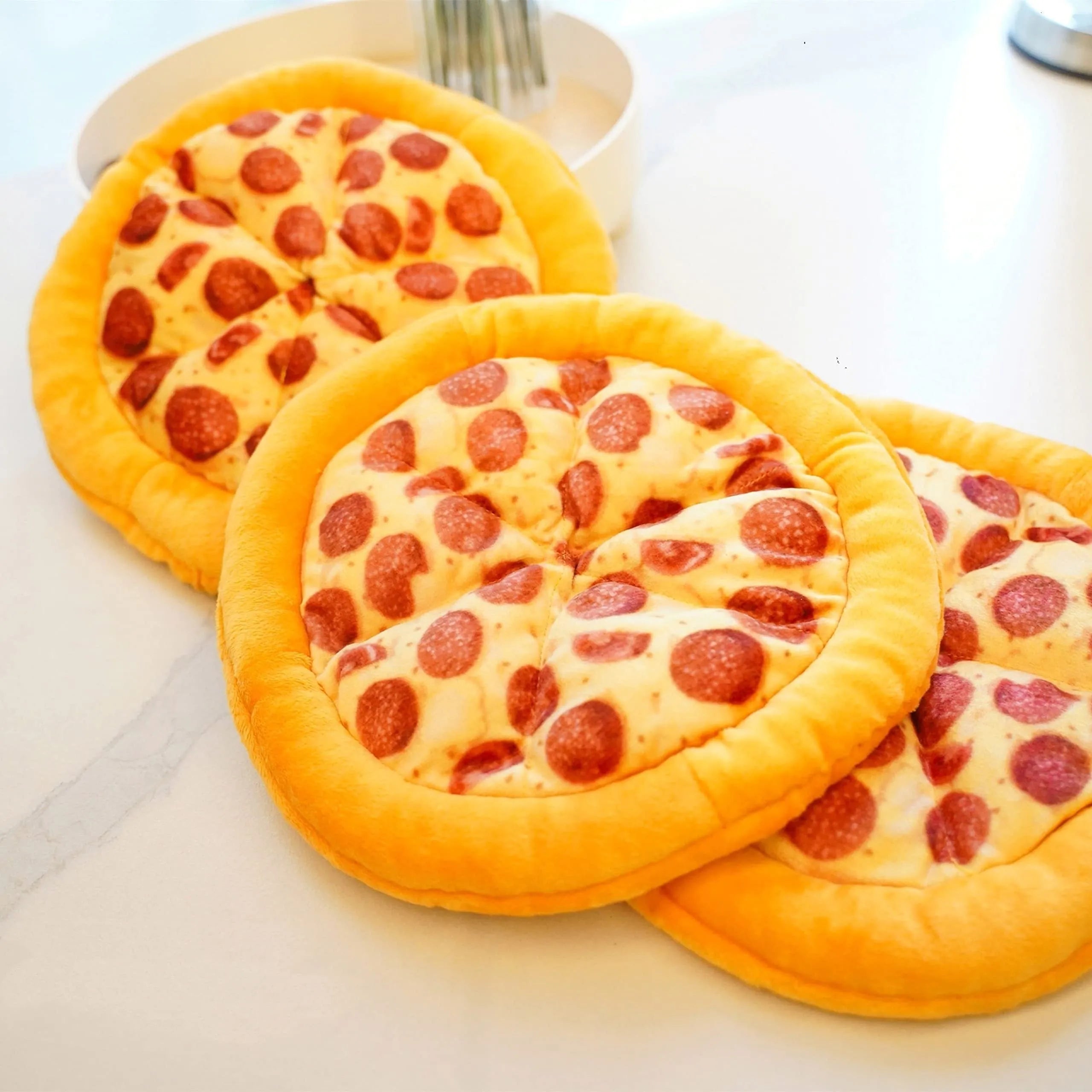 Yellow pizza-themed plush dog toy with squeaker for chewing and interactive play