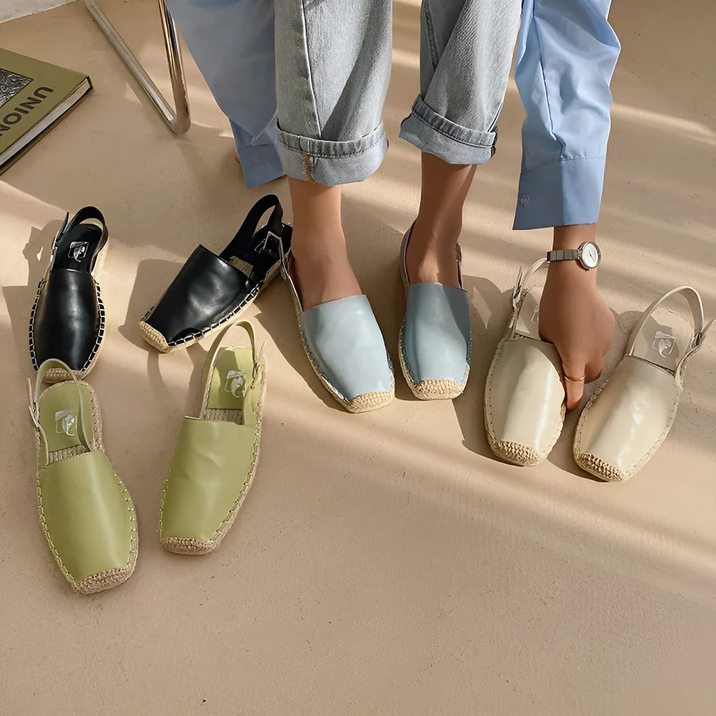 Women's beige retro fisherman flat sandals with canvas upper on a neutral background.