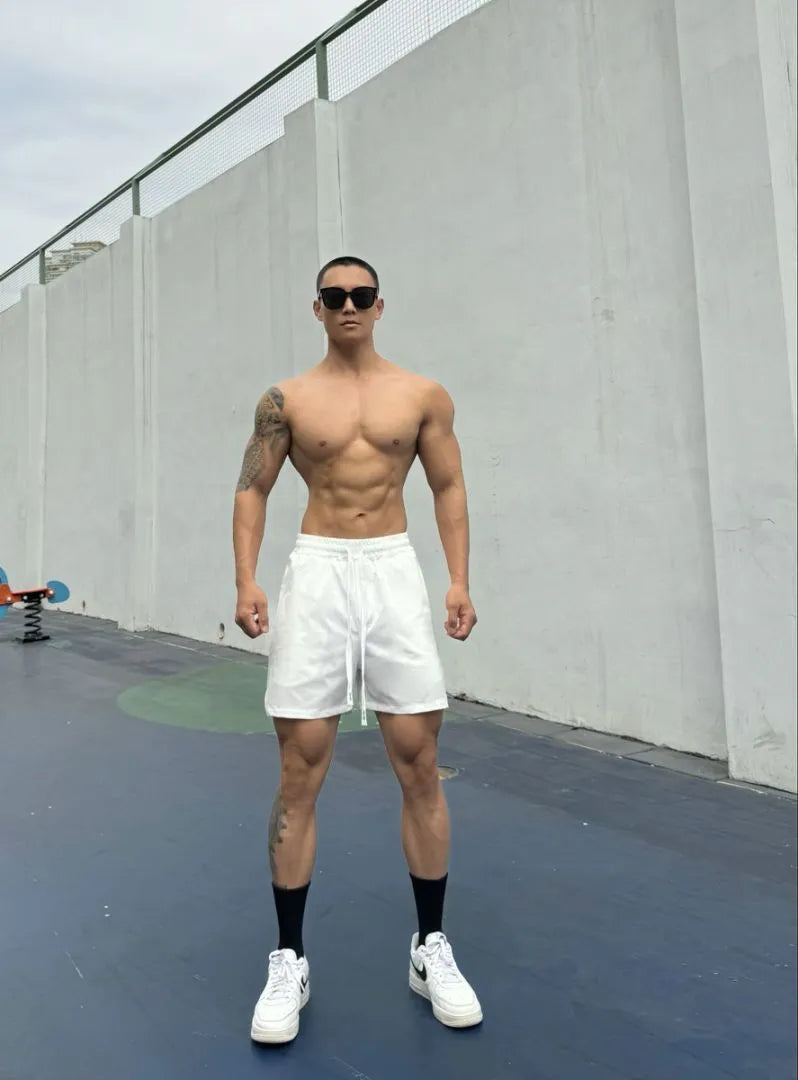 Men's ice silk quick-drying double-layer casual shorts in multiple colours on a size chart.