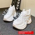 White women's lace-up dad shoes with a round toe and chunky sole for height increase.