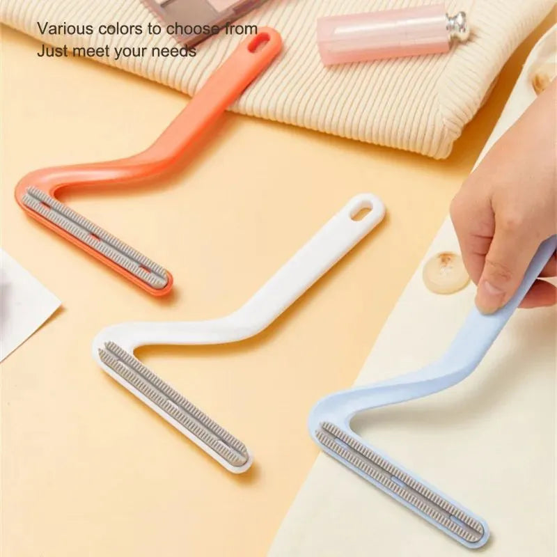 Double-sided pet hair removal comb in blue, white, and orange with sticky suction for cat and dog hair