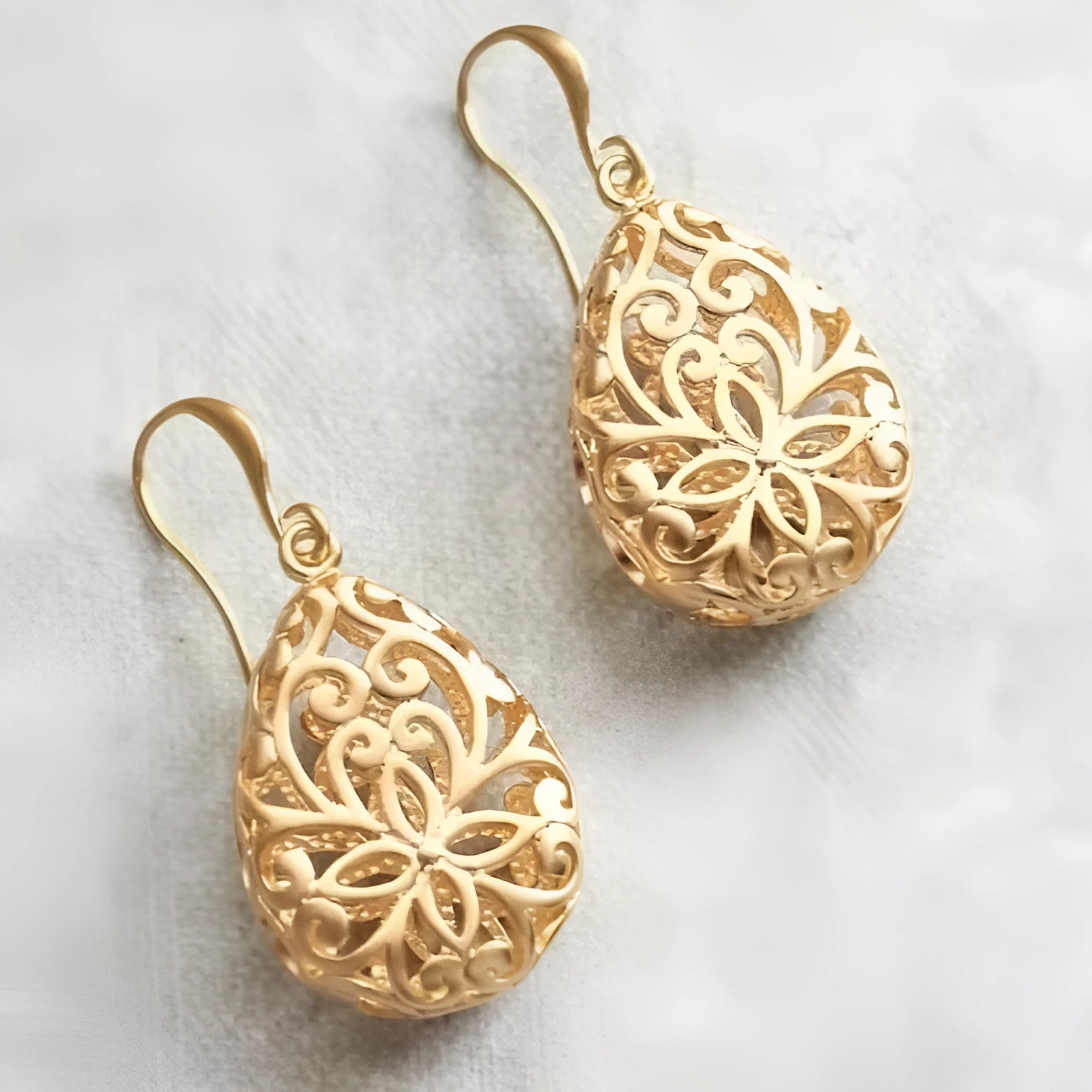 18K gold copper hollow carved geometric earrings with grid and cone design on white background