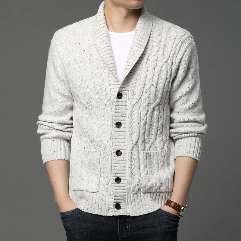 Man wearing a black Korean-style jacquard patterned knitted cardigan jacket.