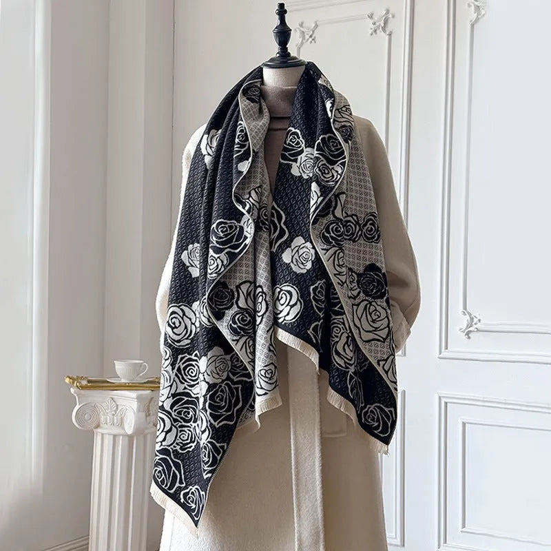 Long grey imitation cashmere winter scarf with tassel fringe on a neutral background.