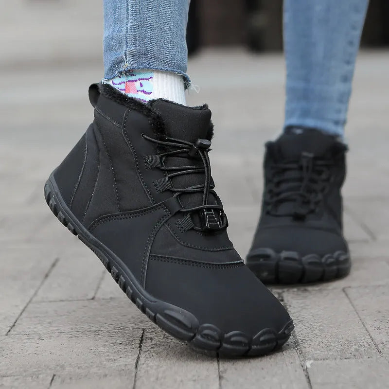 Black unisex waterproof winter snow boots with fleece lining and rubber sole on a wet surface.